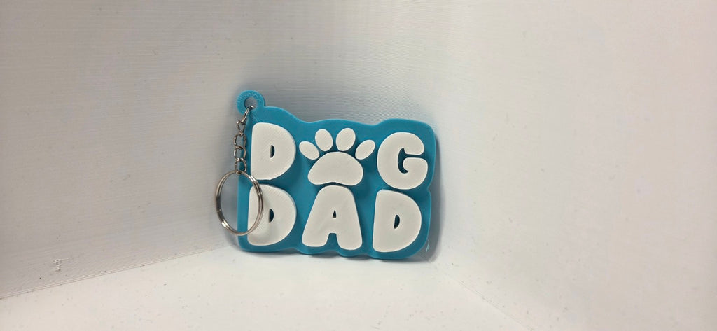 Dog Dad keyring turquoise and white