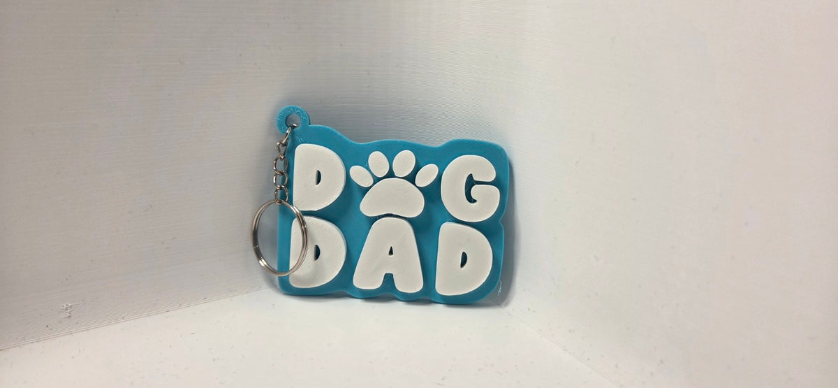 Dog Dad keyring turquoise and white