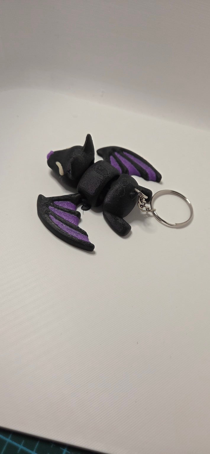 Black and purple articulated bat keyring
