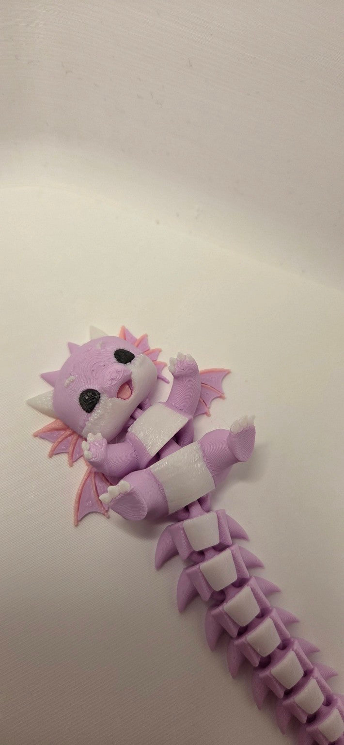 Pink lilac and white 3D printed articulated baby dragon