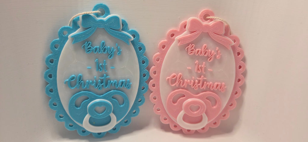 Baby's First Christmas oval dummy and bow decorations in blue and pink