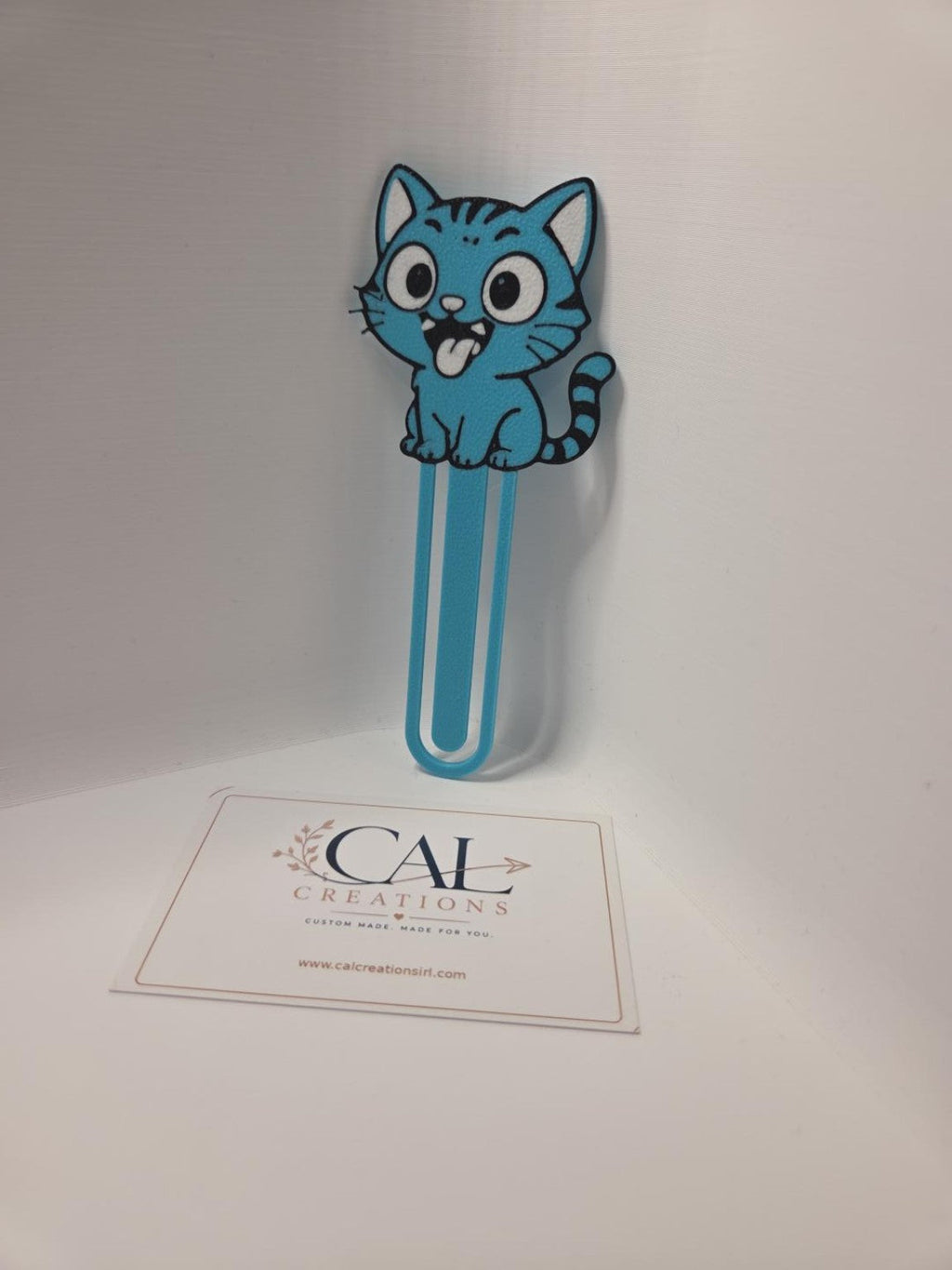 Blue cartoon cat bookmark angled view