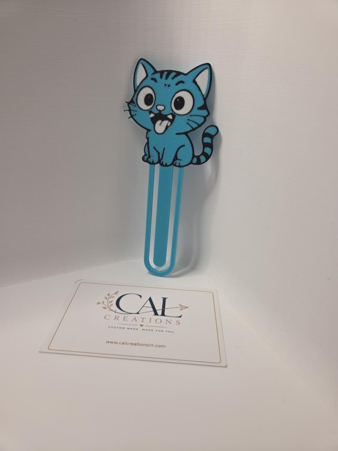 Blue cartoon cat bookmark angled view