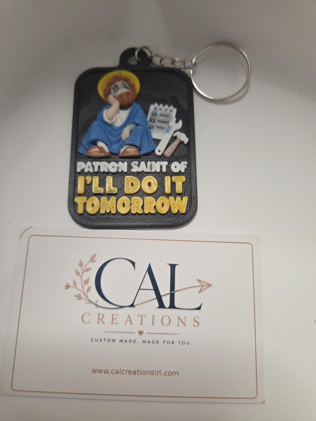 Patron Saint of I'll Do It Tomorrow keyring finished product detail view