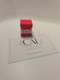 Front photo of red and white TNT block mechanical clicker