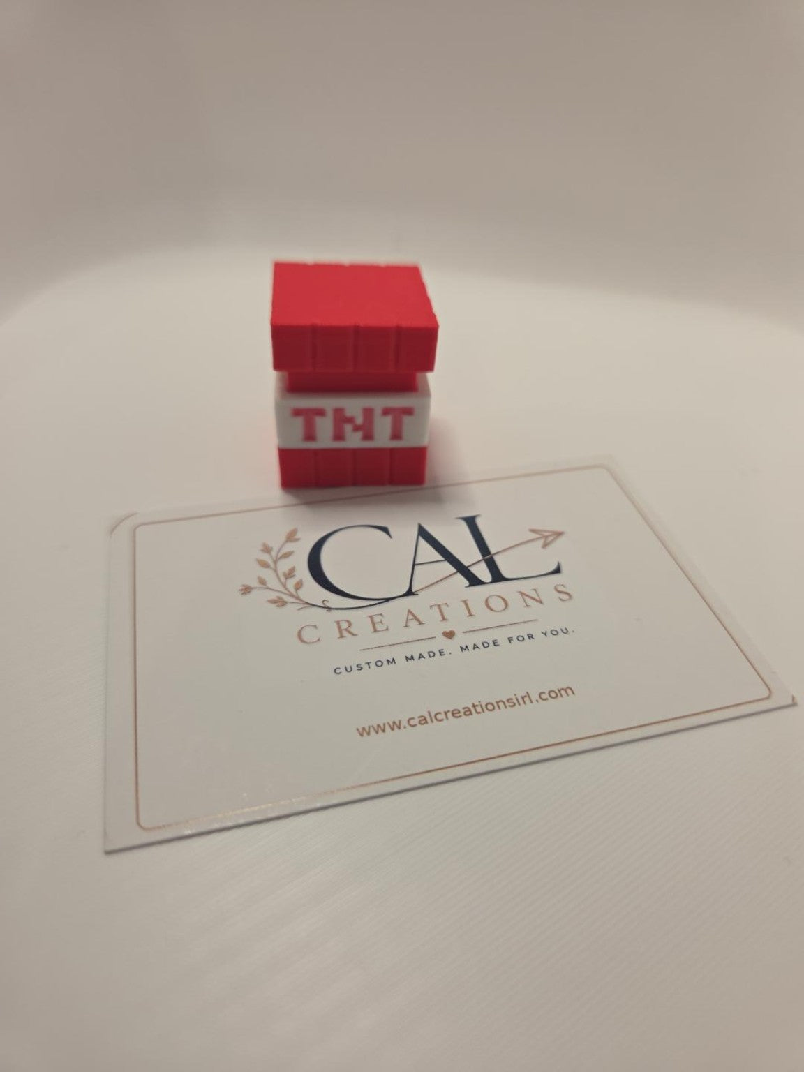 Front photo of red and white TNT block mechanical clicker