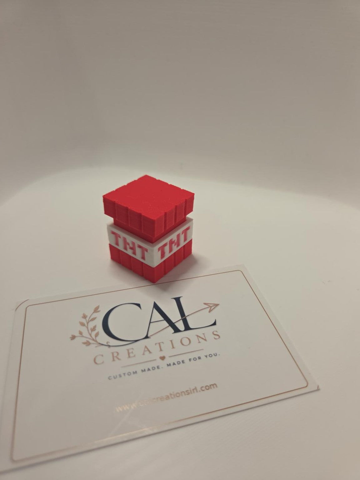 Angled view of red and white TNT block clicker