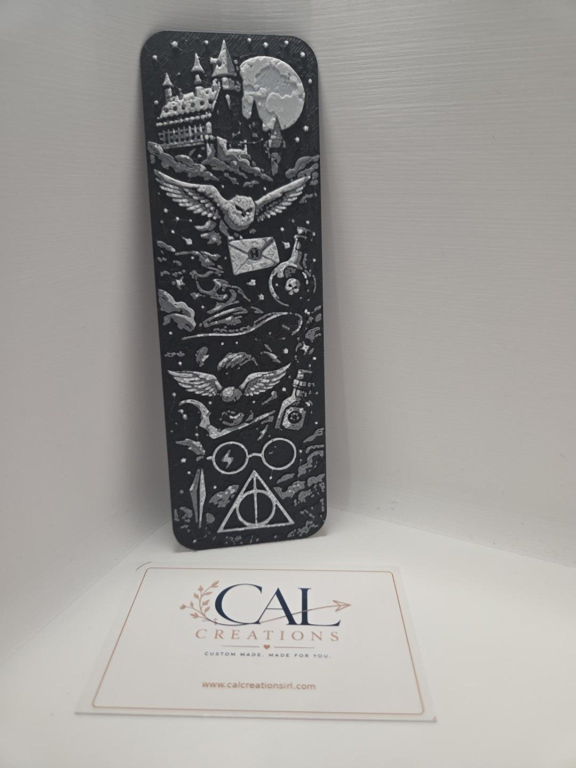 Black and white wizarding magic bookmark showing castle owl and magical symbols
