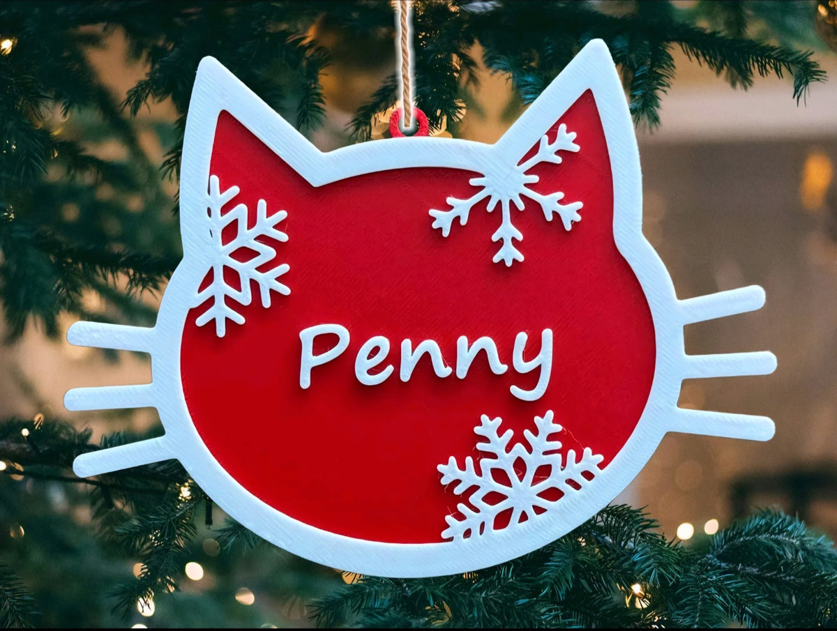 Personalised red and white cat Christmas decoration with the name Penny