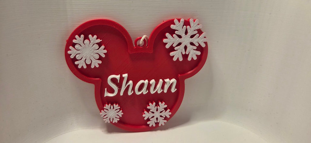 Red and white personalised Christmas mouse ears decoration with snowflakes and the name Shaun